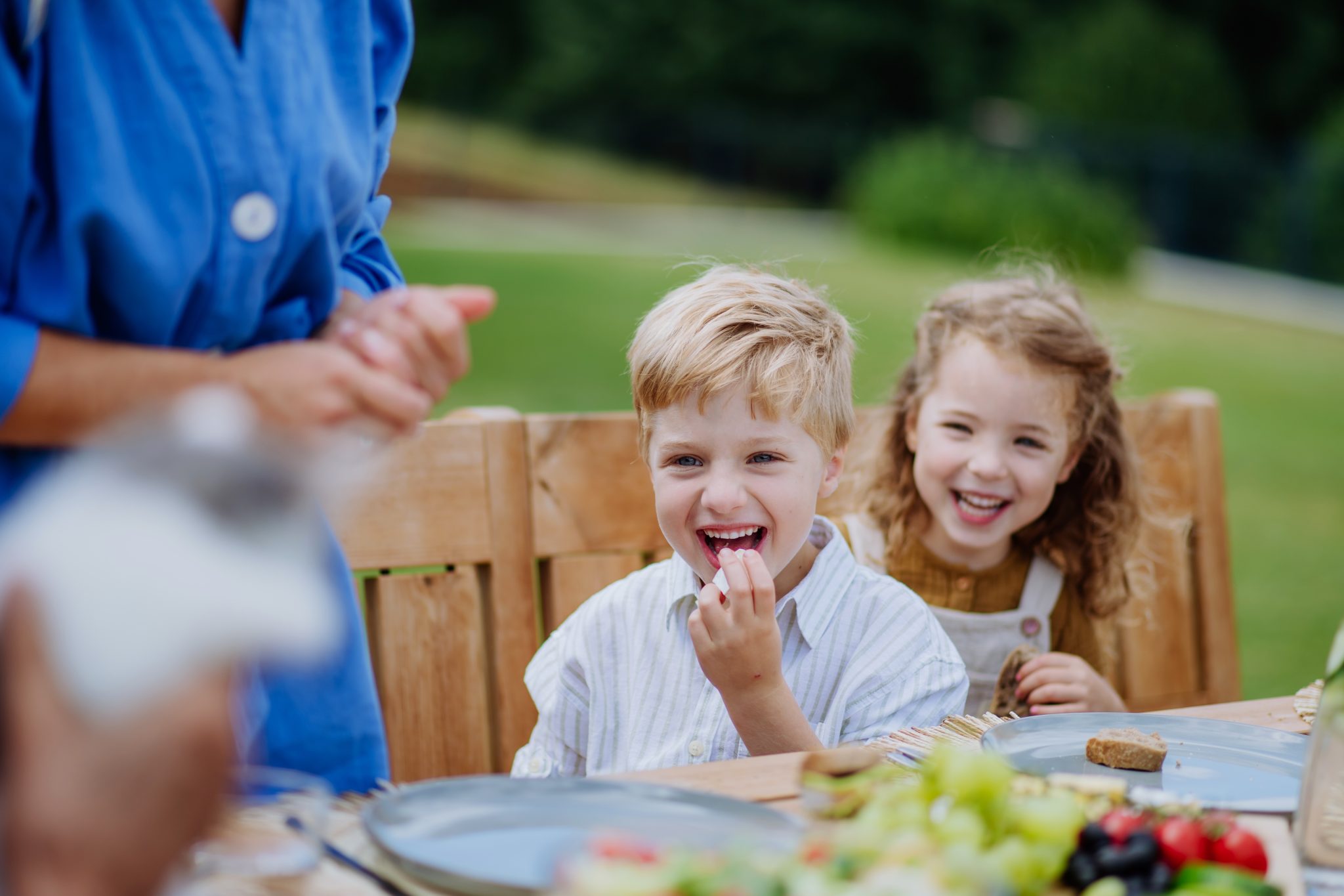 Happy children enjoying lunch near Charlemont