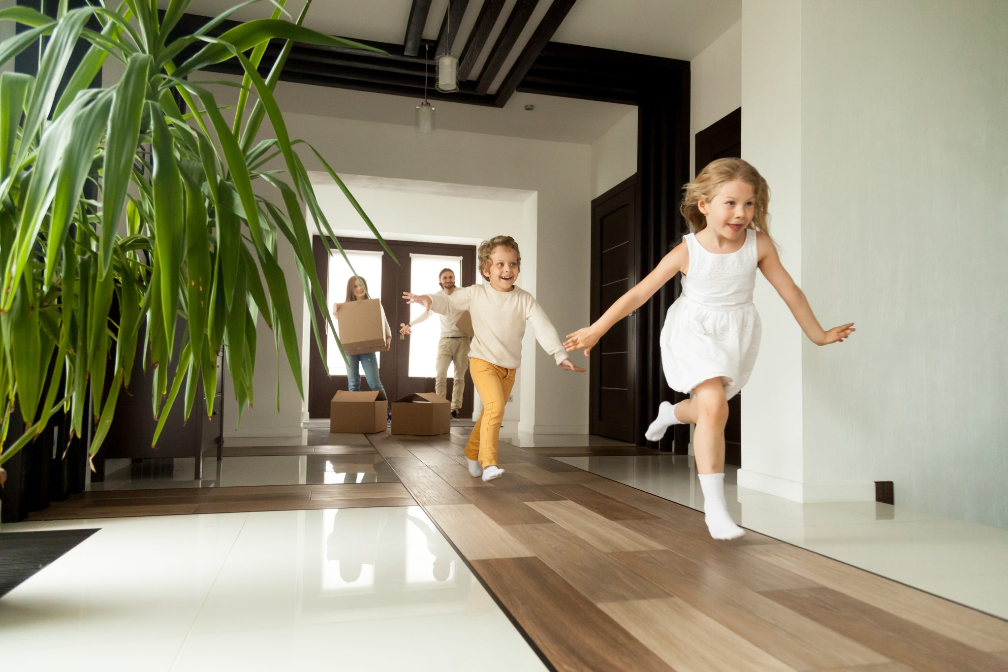 Children running into their new home at Armstrong Creek